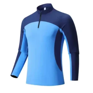 A technical sky blue athletic top featuring a quarter-zip collar and navy blue color-blocked panels on the shoulders and sides.