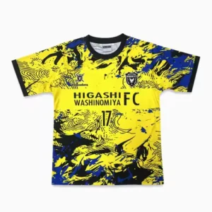 A bright yellow athletic t shirt with black abstract sublimation patterns and team crest details.