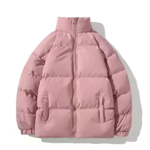A soft dusty pink puffer jacket featuring a warm stand collar and a relaxed, insulated fit.