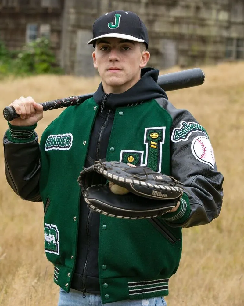 a local rugby club player wearing green letterman jacket with black leather sleeves holding a baseball bat in hand