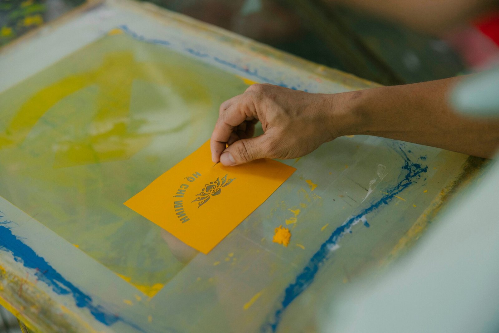 Screen printing process at Zedline Apparel factory in Sialkot